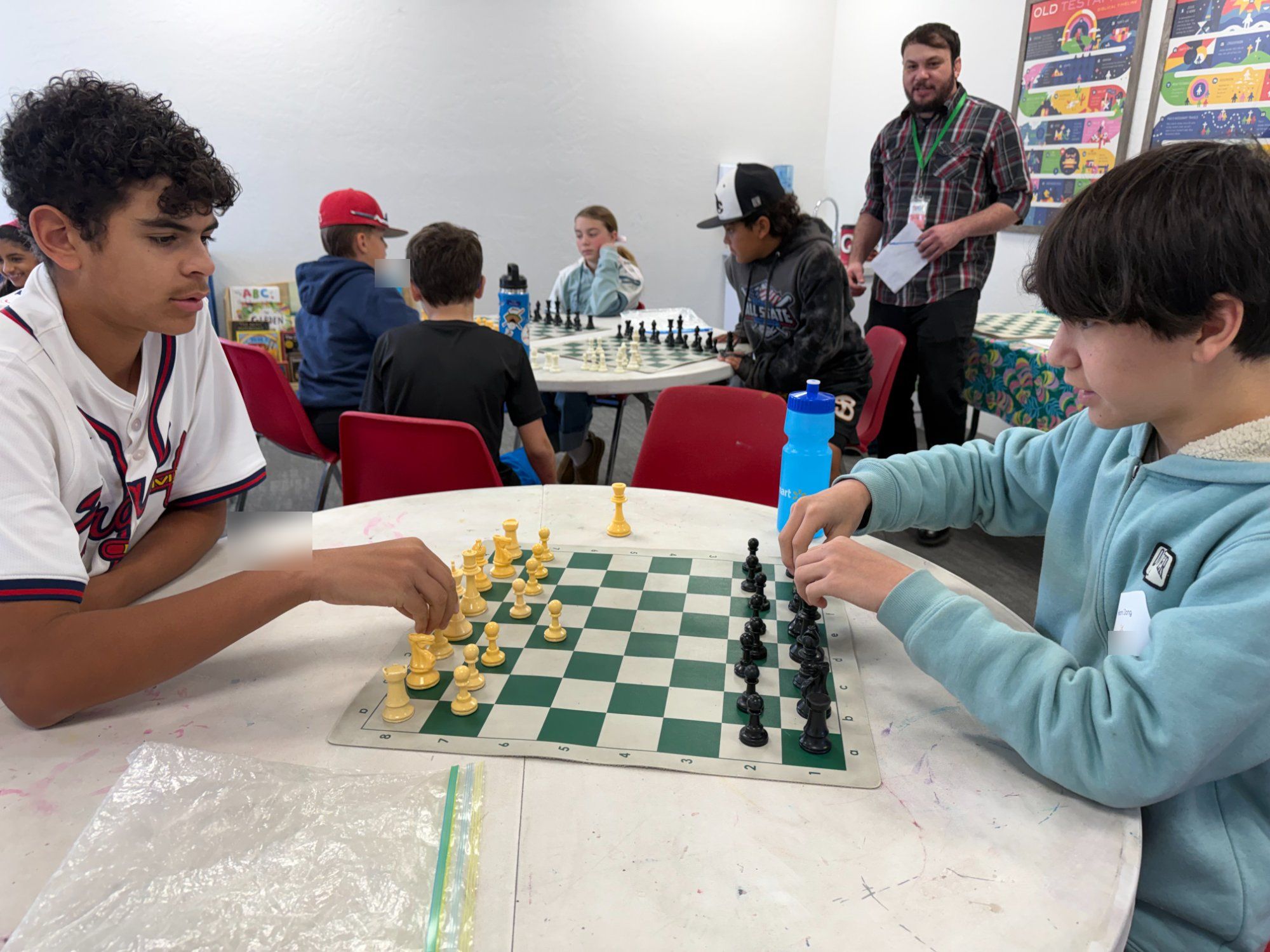 Students playing chess at PATH Collective