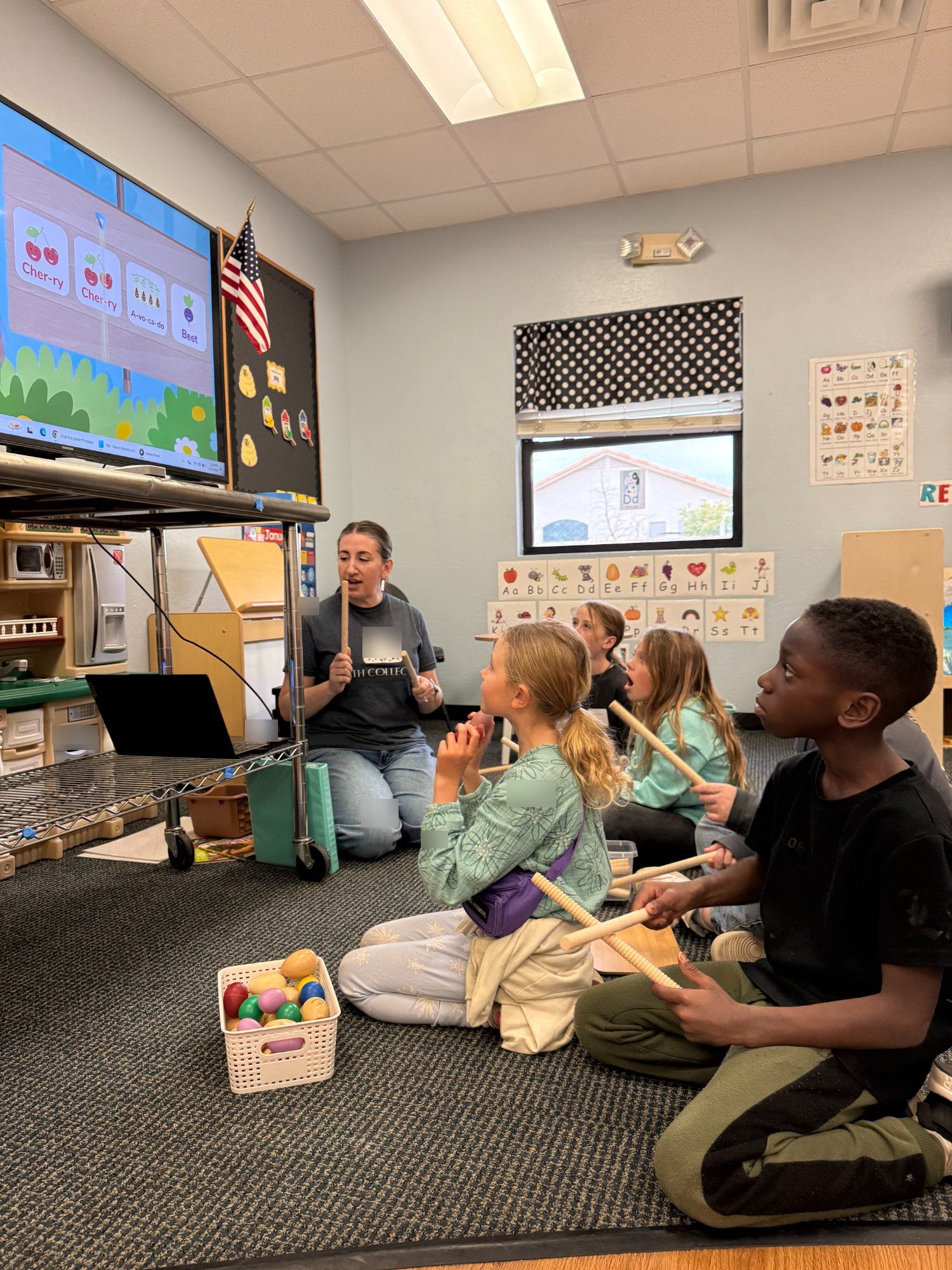 Music class at PATH, teacher in PATH shirt with students